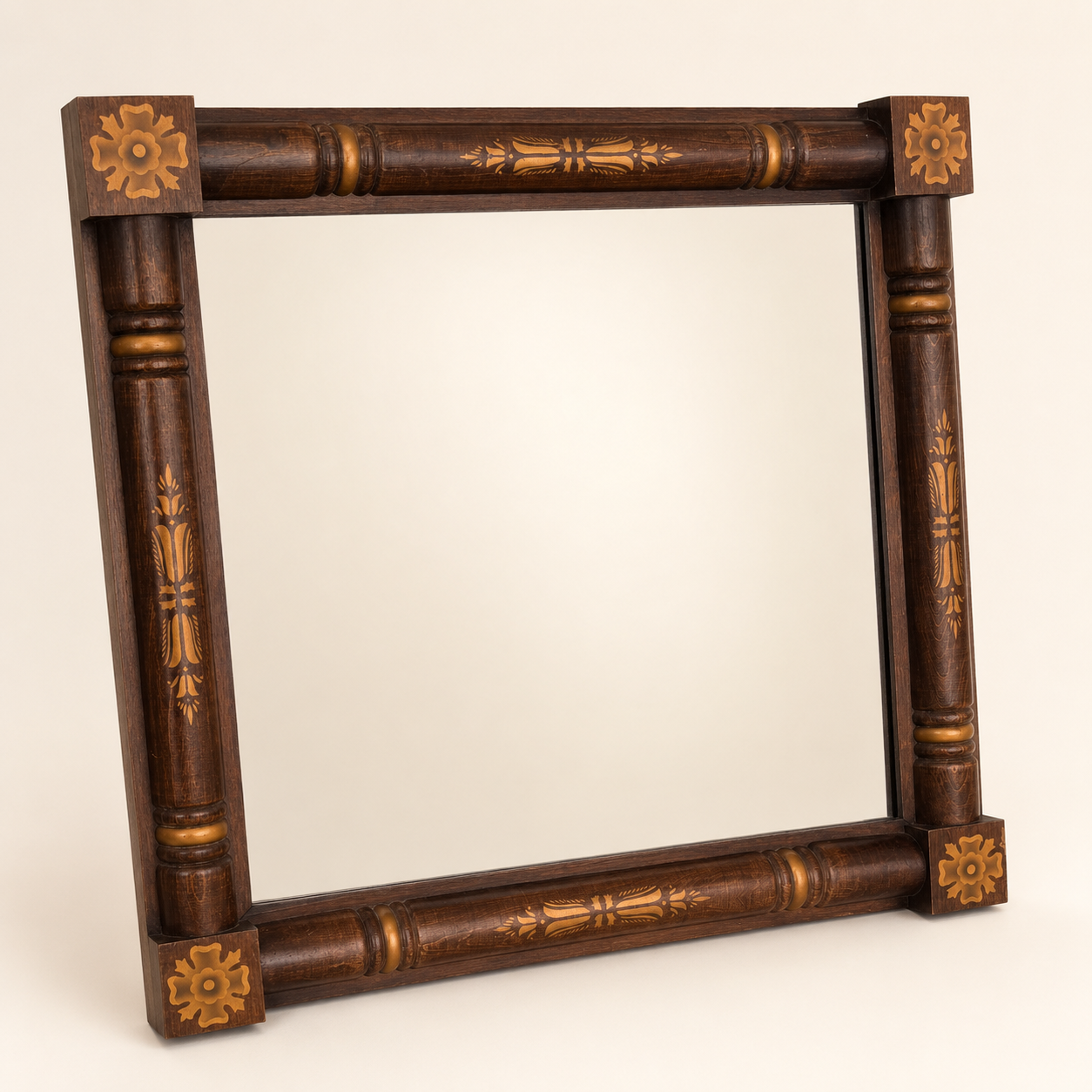 Angled view of vintage Hitchcock stenciled column mirror