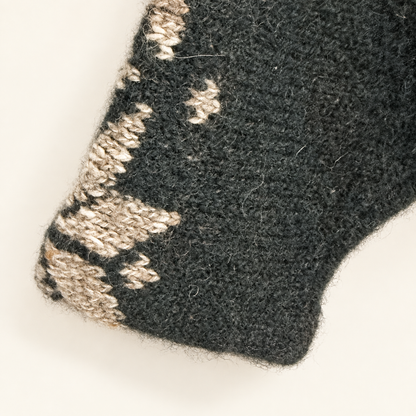 Cuff with snowflake pattern on vintage green wool sweater
