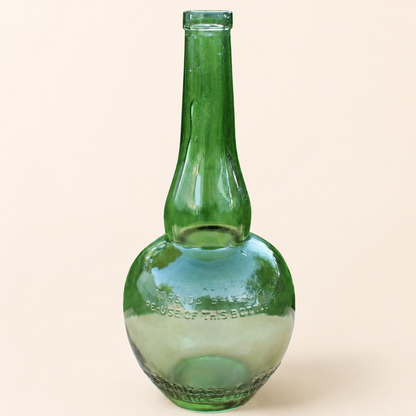 Vintage Marie Brizard green glass liquor bottle, front view