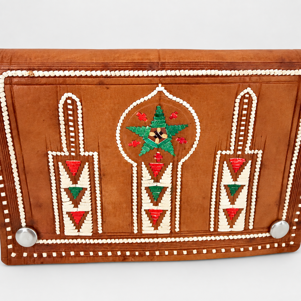 Close-up of embroidered minaret arches, green star and silver studs on Moroccan wallet flap, photo 2 of 4