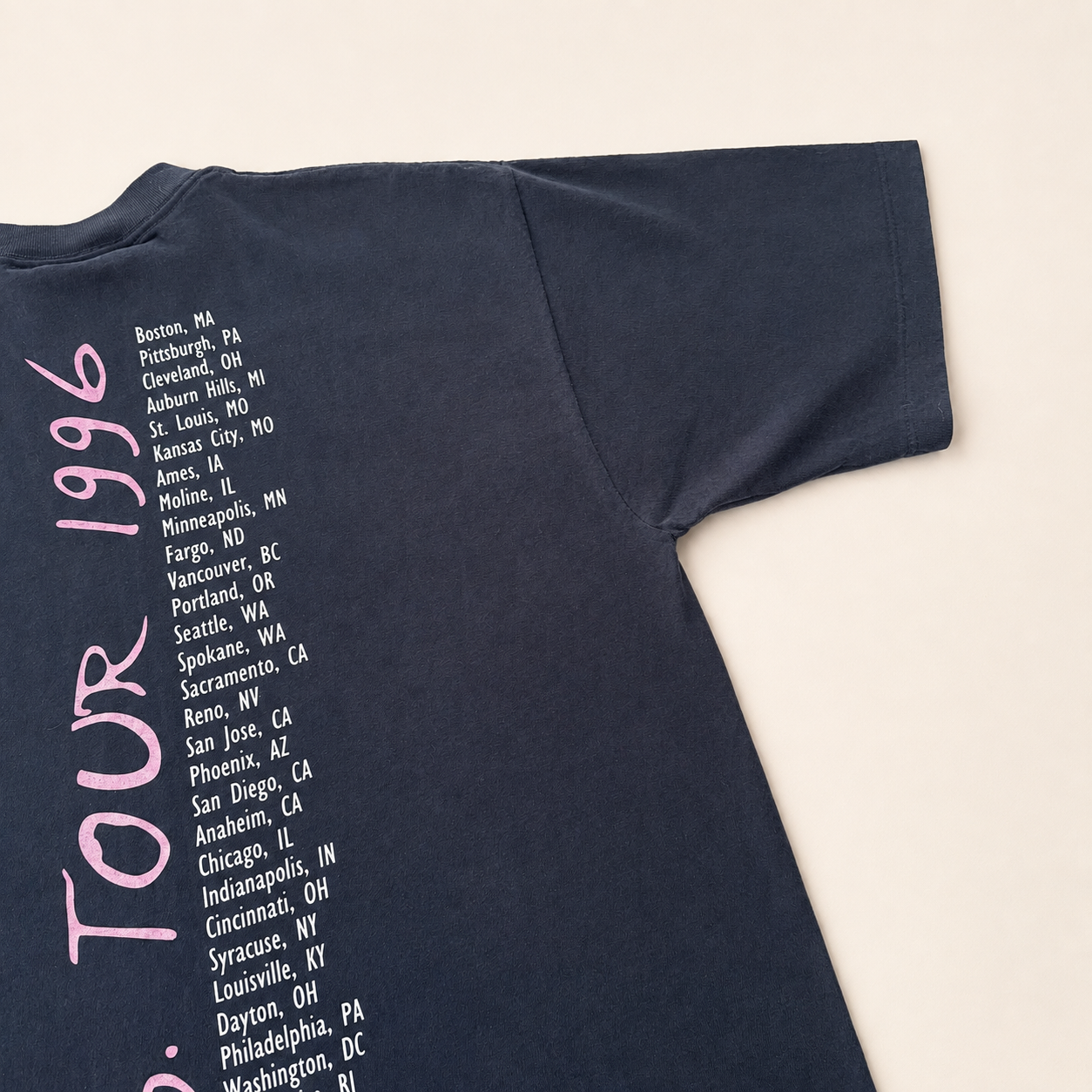 Back right sleeve of 1996 Neil Diamond U.S. Tour tee showing pink script tour dates