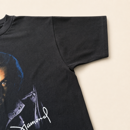 Right sleeve of vintage 1996 Neil Diamond U.S. Tour tee, single stitch black cotton