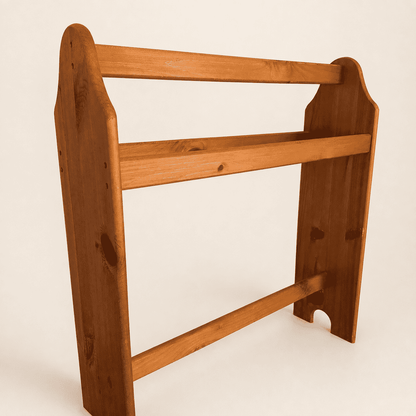 Angled view of the pine quilt rack showing the three rails