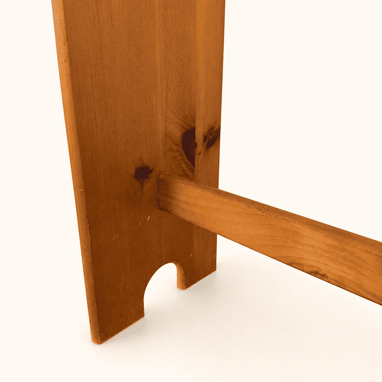 Detail of a rail and scalloped side panel on the pine quilt rack