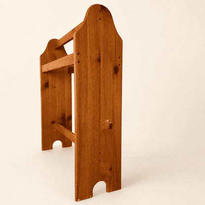Angled side view of the vintage pine quilt rack