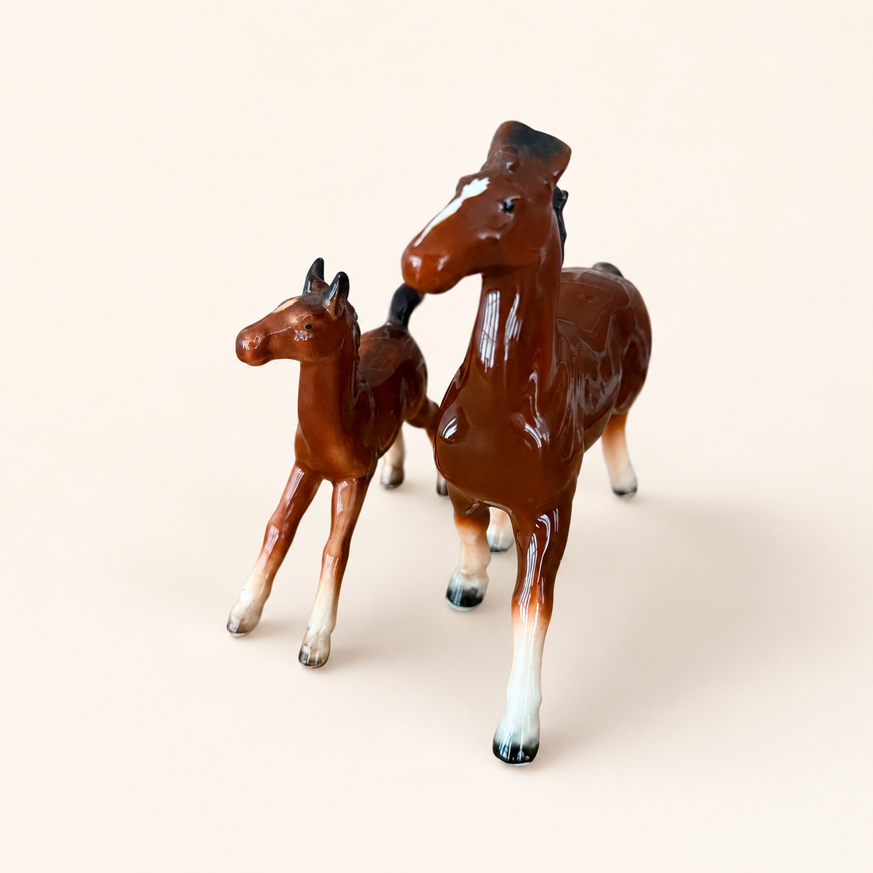 Front detail of porcelain horse figurines showing painted faces