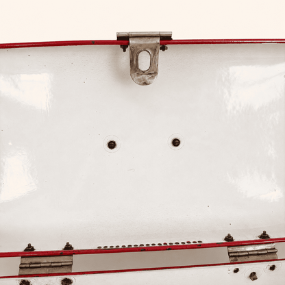 Interior of the lid showing hinge, latch catch, and mounting holes