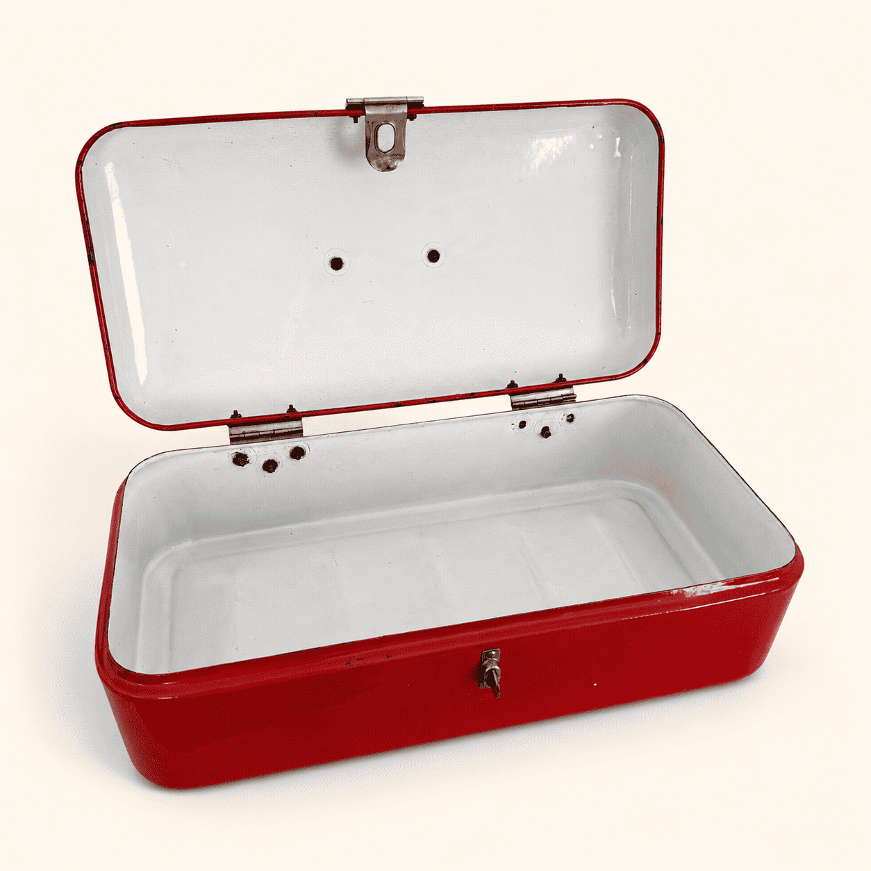 Top-down view into the open red bread box showing white interior
