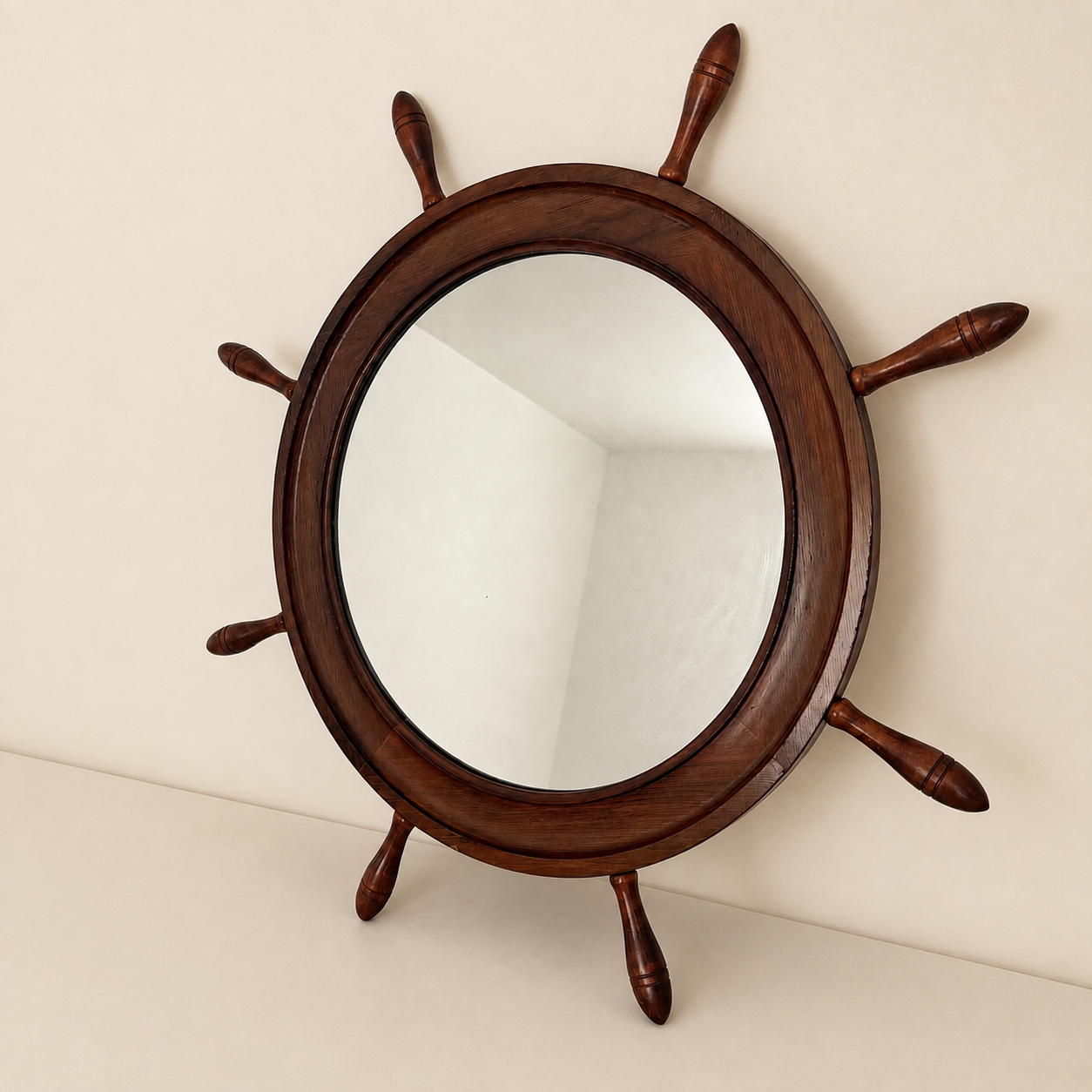 Angled view of the wood ship's wheel mirror on a wall