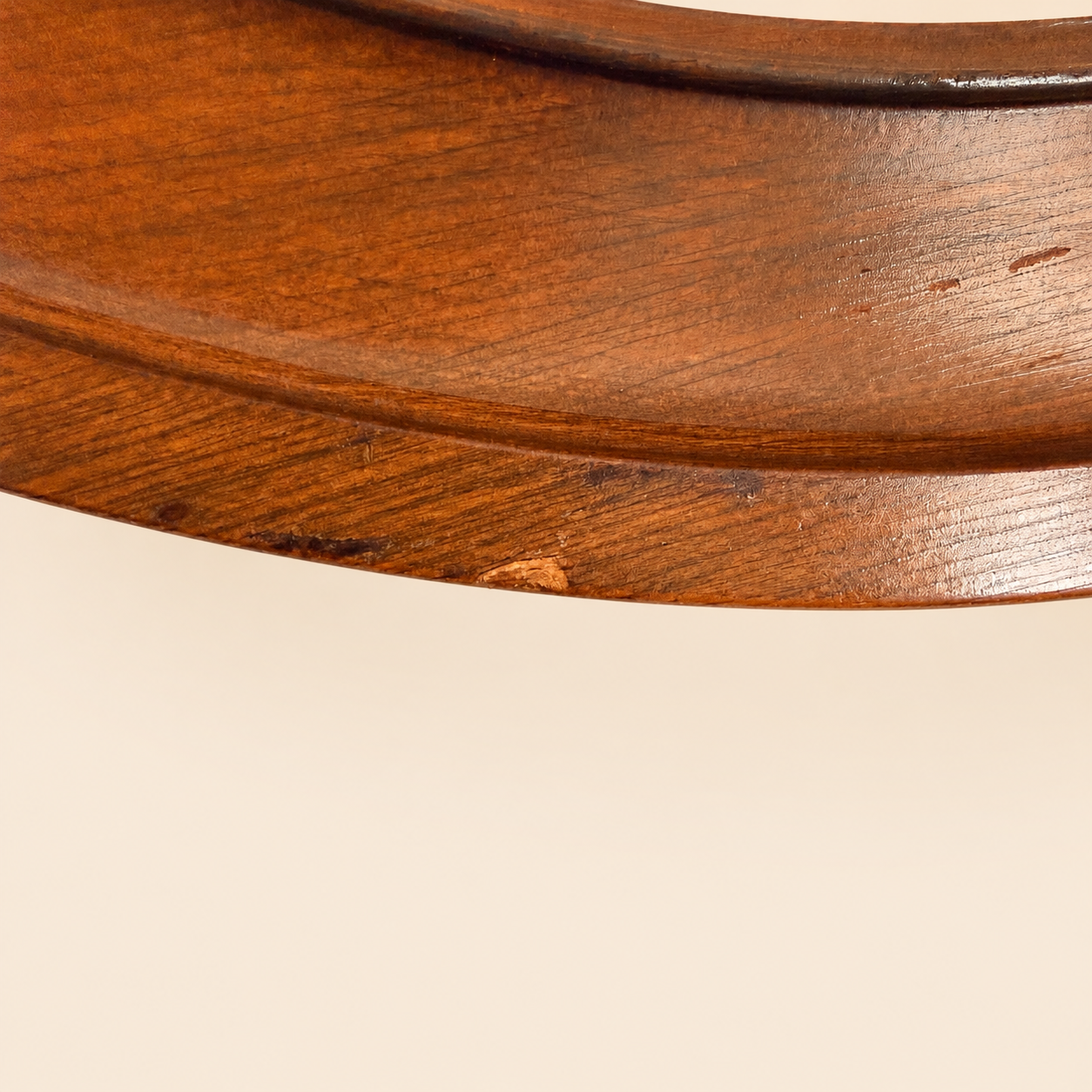 Close-up of the wood grain on the ship's wheel frame