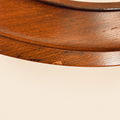 Close-up of the wood grain on the ship's wheel frame