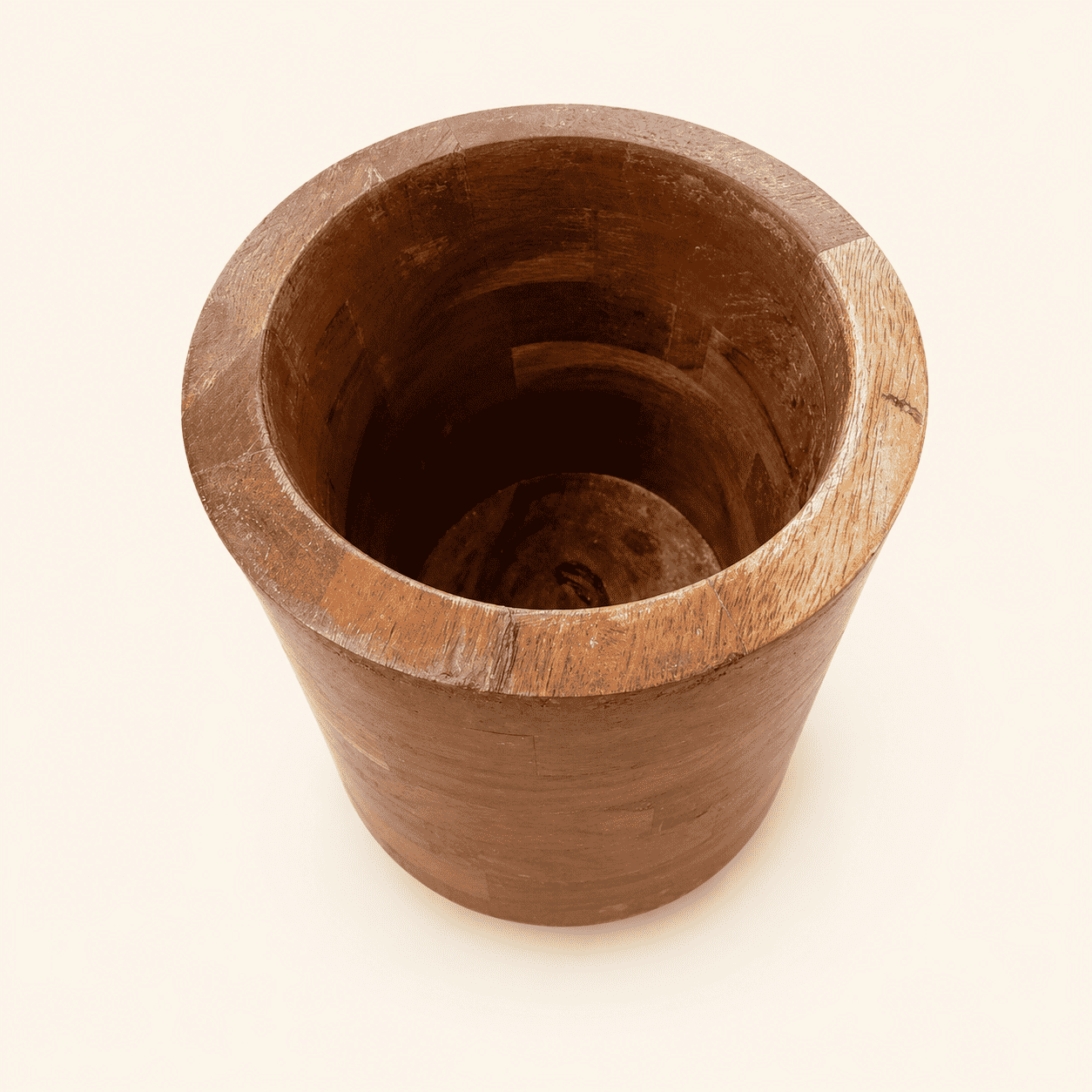 Top-down view into vintage walnut wine chiller showing hollow staved interior
