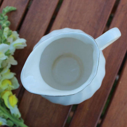 Vintage white ceramic swirl creamer with silver trim, photo 6 of 10