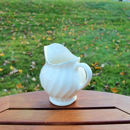 Vintage white ceramic swirl creamer with silver trim, photo 9 of 10