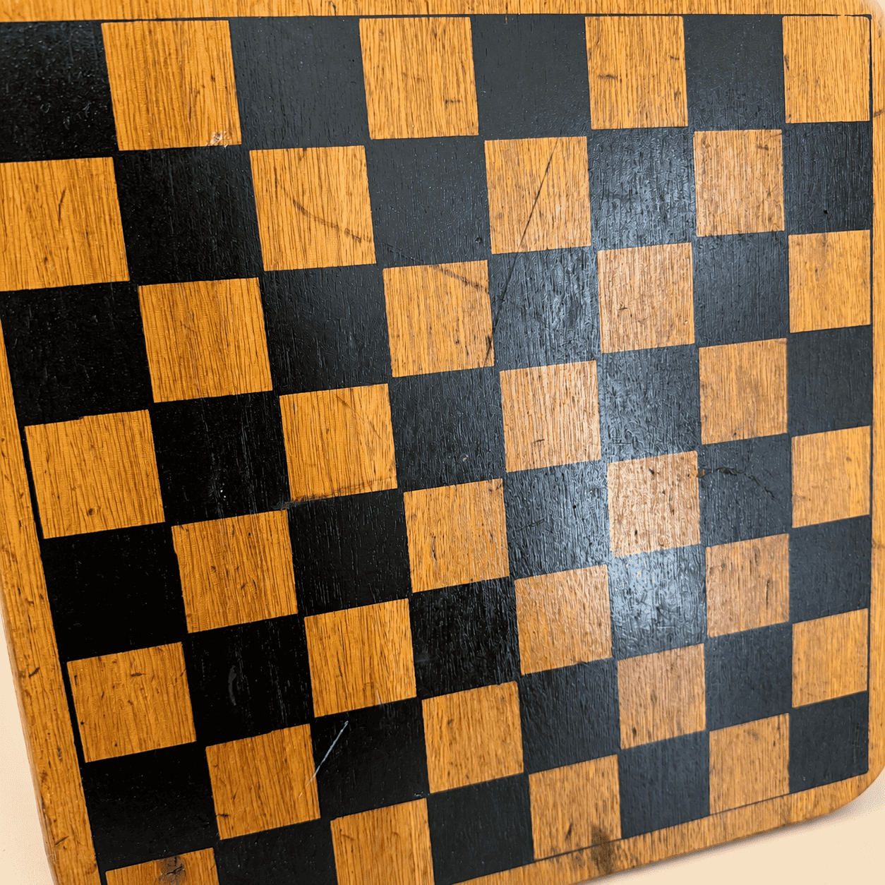 Detail of the worn checkerboard squares showing age and patina