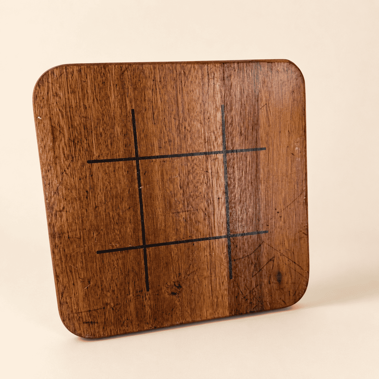 Reverse of the game board showing the tic-tac-toe grid