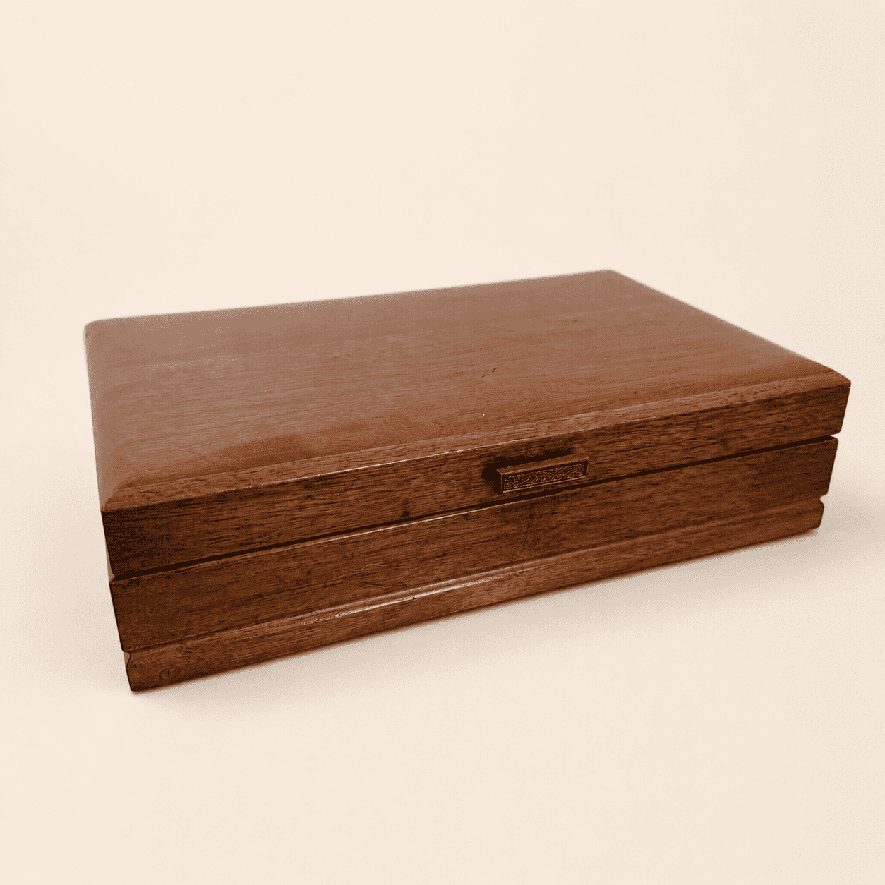 Closed vintage wood jewelry box with metal clasp, front view