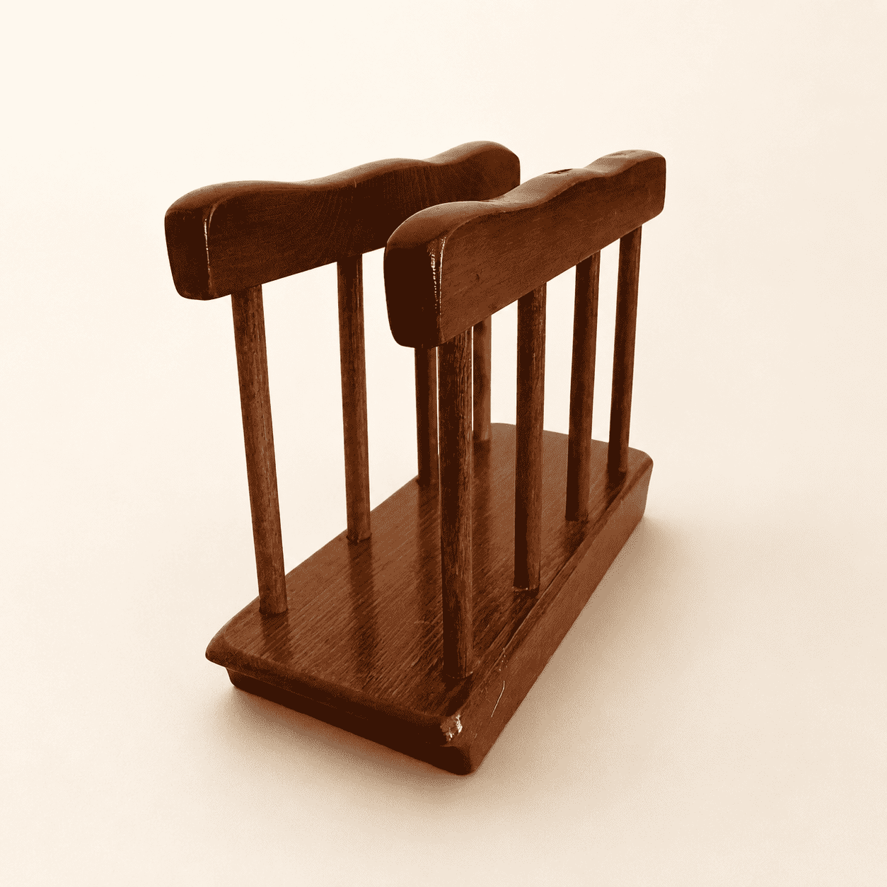 Angled view of the colonial-style wood napkin holder