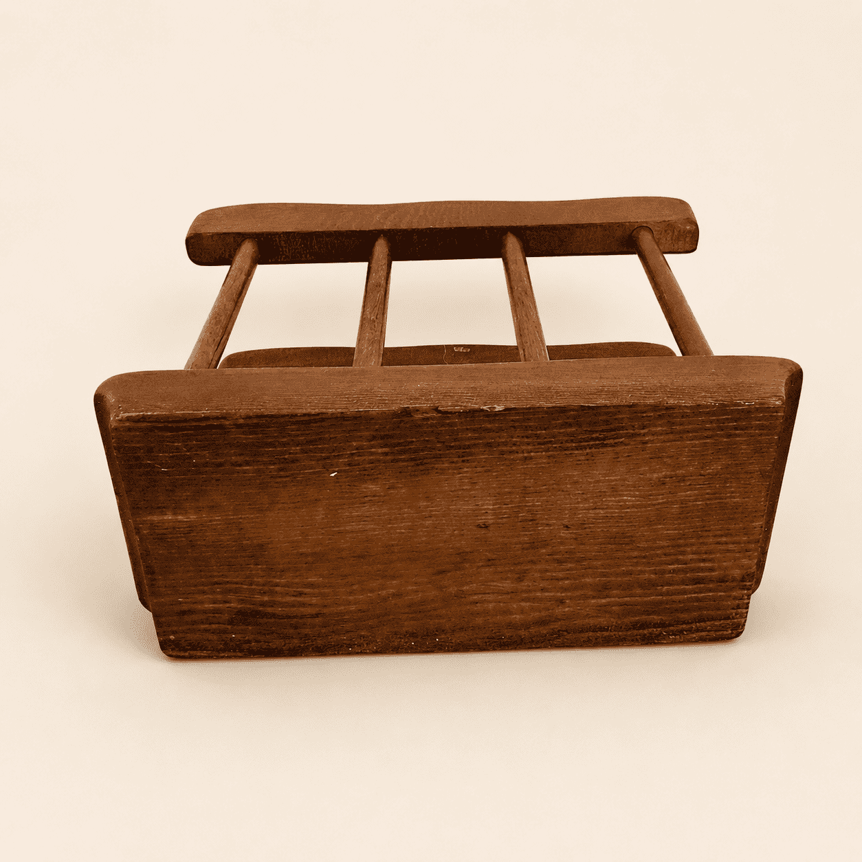 Bottom view of the napkin holder showing the spindle rails