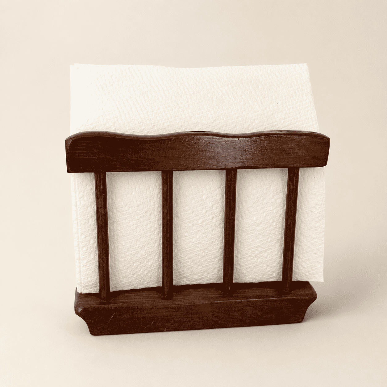 Wood napkin holder styled with a white napkin