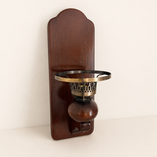 Vintage wood wall sconce candle holder with brass cup, three-quarter front view