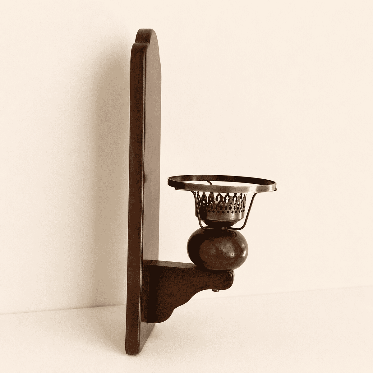 Vintage colonial wood wall sconce candle holder with brass cup, angled view