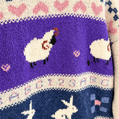 Purple band of sheep on vintage Woolrich wool sweater