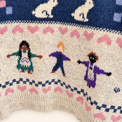 Navy band of bunnies and dancing children on Woolrich folk sweater