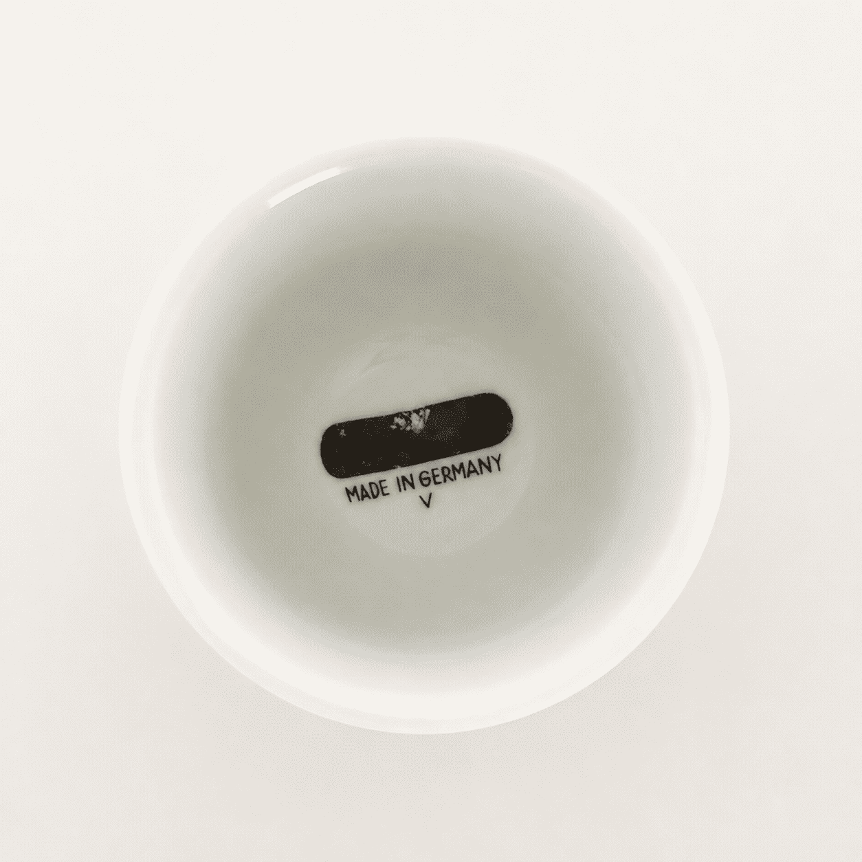Base of white porcelain footed cup showing "Made in Germany" mark