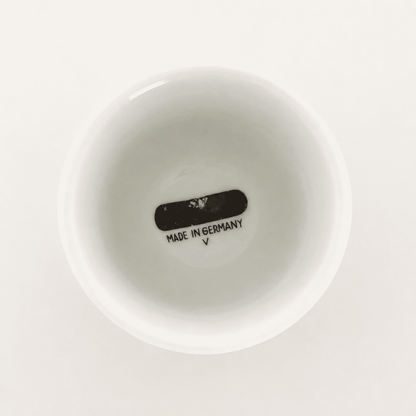 Base of white porcelain footed cup showing "Made in Germany" mark