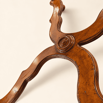 Shaped X-stretcher with carved oval boss on William & Mary style coffee table