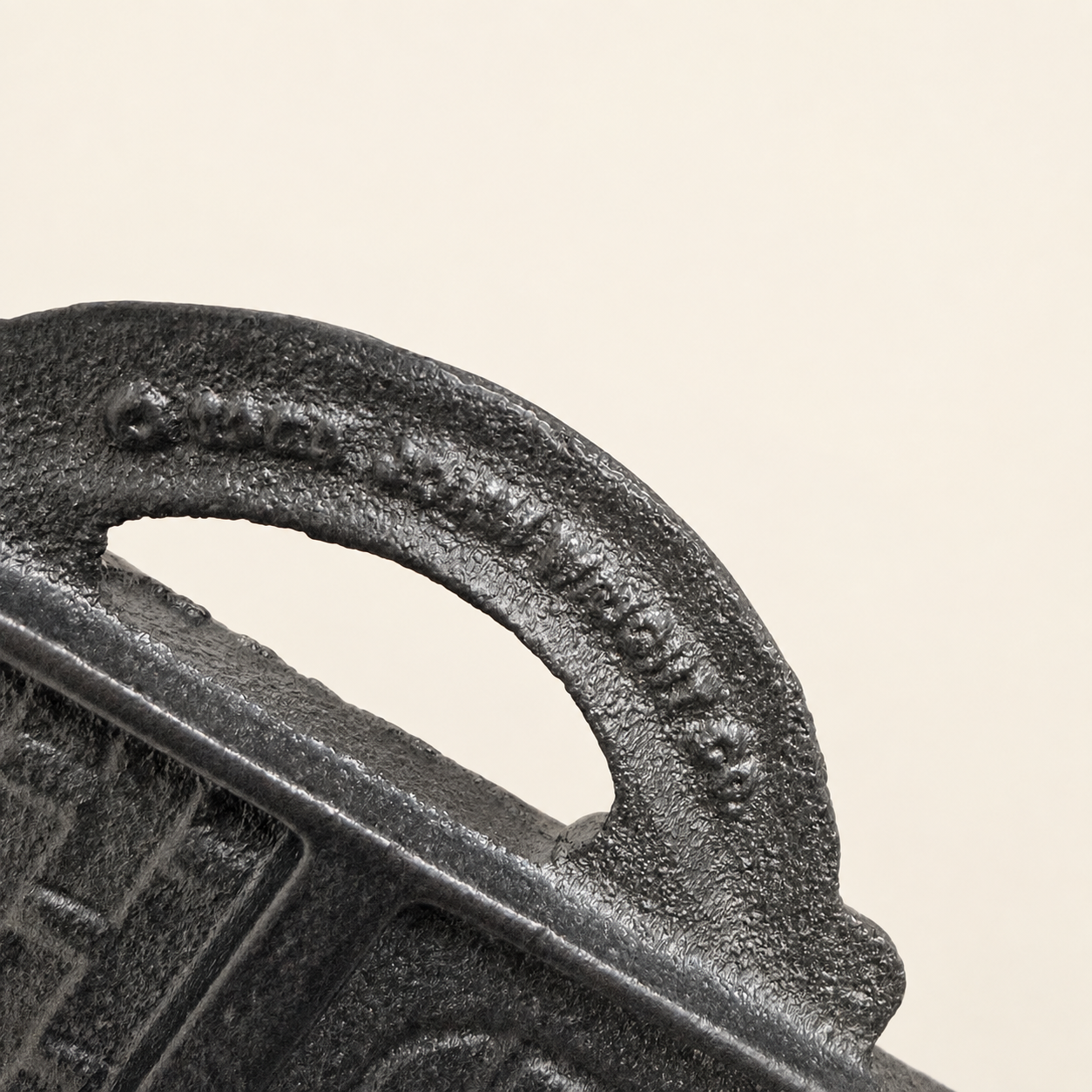 Close-up of the mold handle showing molded copyright and maker mark